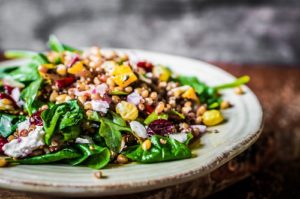 Healthy salad with spinach,quinoa and vegetables