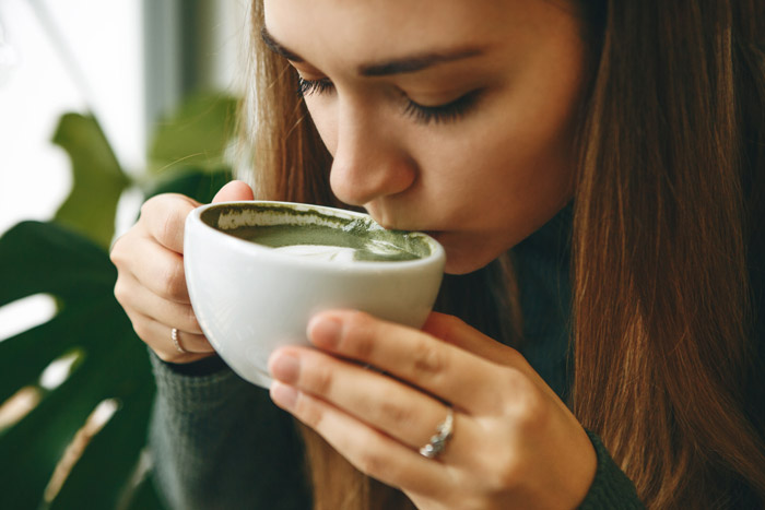 Woman drinking matcha