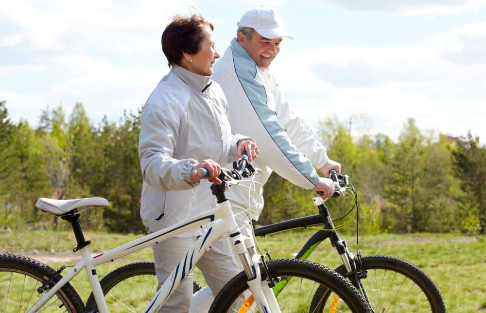 Senior couple going cycling.